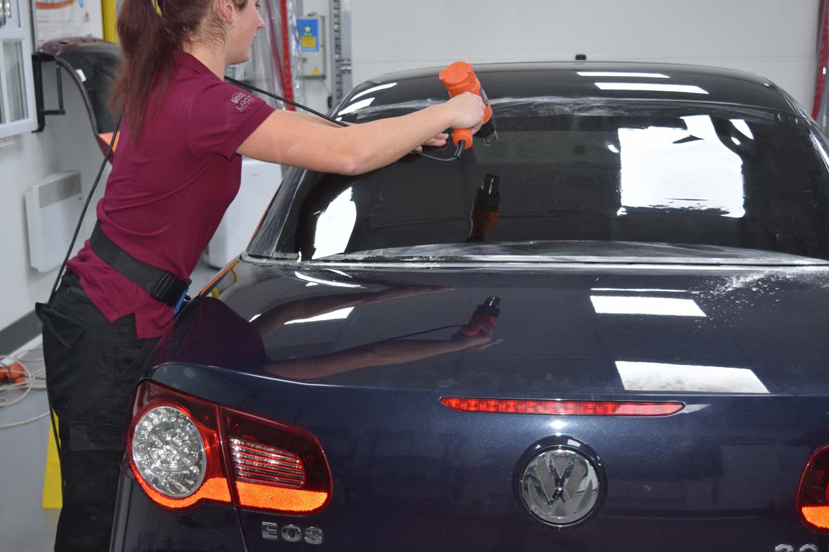 Vehicle window tinting in progress