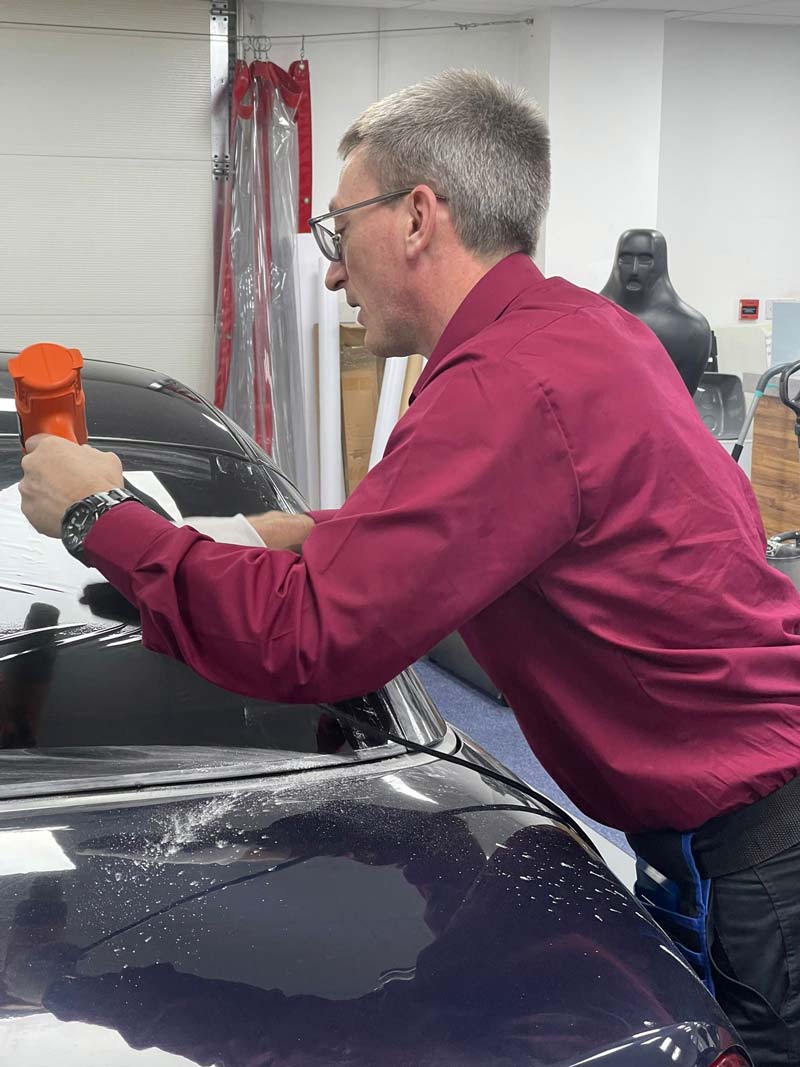 Vehicle window tinting in progress