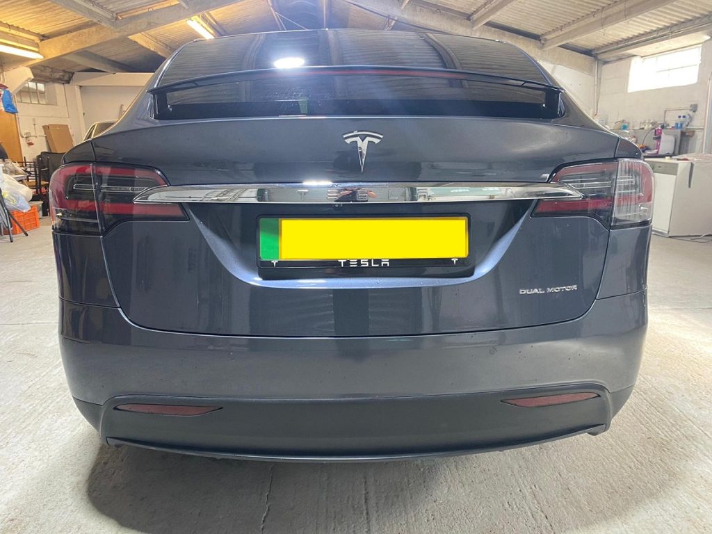 Tesla Model X SUV rear boot strip prior to dechrome